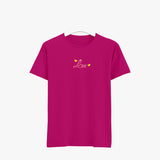 A pink women's crew neck t-shirt with the word 'Love' printed on the front in stylized lettering.