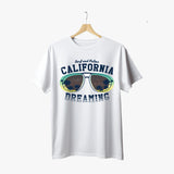 A white crew neck t-shirt with green and yellow text and graphic design, displayed on a wooden hanger.