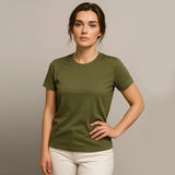 Woman wearing a green t-shirt against a plain background