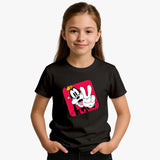 Child wearing a black t-shirt with a cartoon character design on a plain background