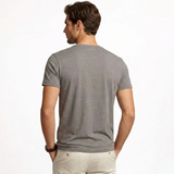 Man wearing a gray t-shirt on a white background